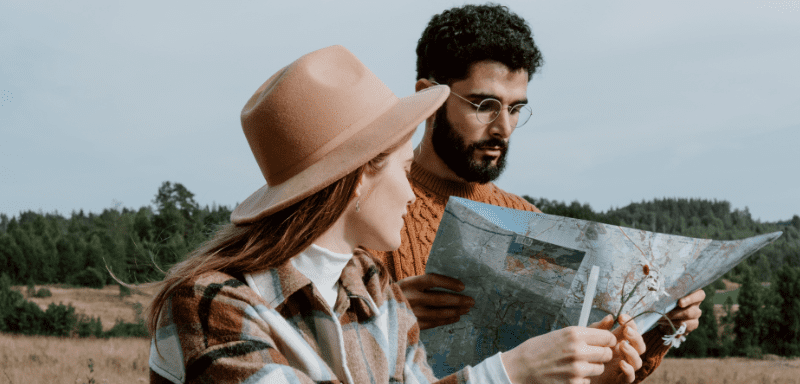 Couple with map in hands.