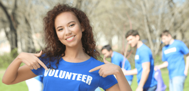 Girl with volunteer t-shirt.